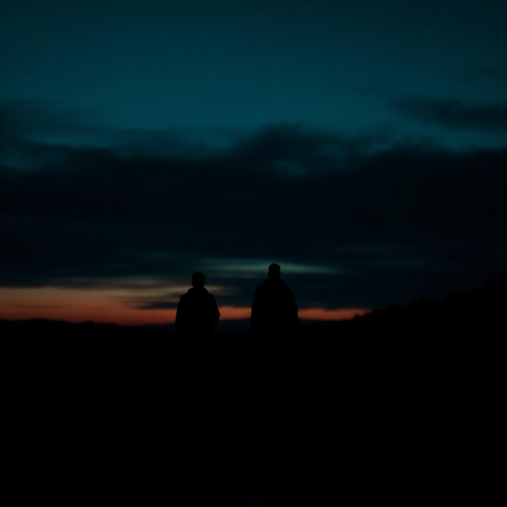 Layered silhouettes washed in deep blue and indigo light